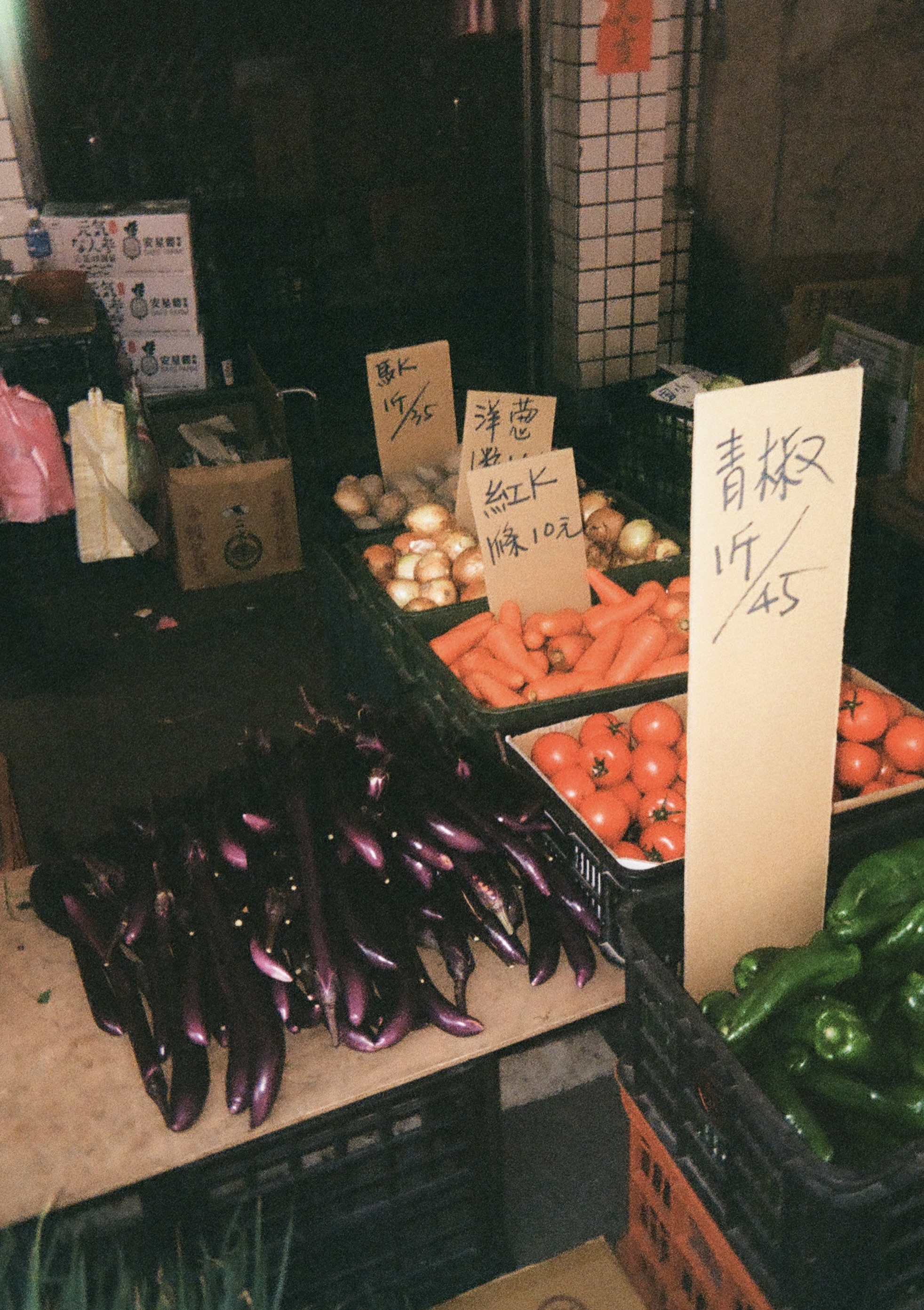 Eggplants, tomatoes, carrots, onions in a market